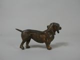 figurine of a dachshund dog on a white background