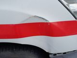 a white van with a red stripe on the side of it