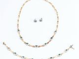 a collection of jewellery including a necklace, bracelet and earrings