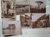 many old photos on the wall of a building