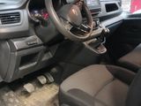 a car that is sitting in a garage with the door open