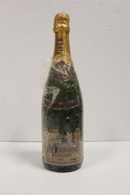 a close up of a bottle of champagne on a table