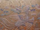 an image of a very old chinese embroidered cloth