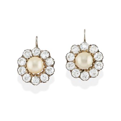 a pair of pearl and diamond earrings