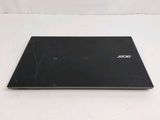 a laptop that is sitting on a white surface