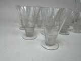 a lot of glasses that are sitting on a table