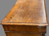 an old wooden desk with a drawer on top of it