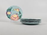 three plates that have been painted with flowers on them