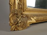 a gold frame with a decorative design on it