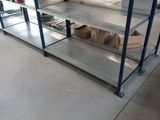 shelves in a warehouse filled with boxes and boxes on top of them