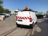 a white van that is parked in a parking lot