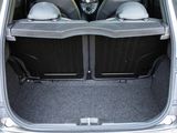 two seats in the back of a car with the doors open
