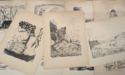 a lot of drawings that are on a table