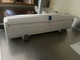a white box sitting on top of a metal table