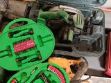a green case with tools inside of it on a table