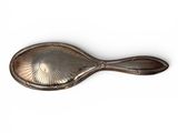 silver plated spoon on a white background with a shadow
