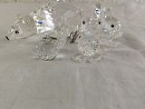 crystal figurines of a bear and a bear cub on a bed