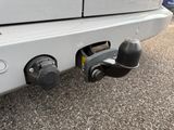 a close up of a car ' s rear bumper with two knobs on it
