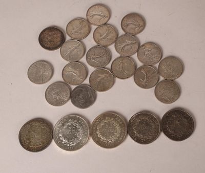 a lot of coins sitting on a white surface