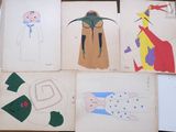 several children ' s drawings of different characters are displayed on a table