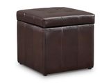 un pouf en cuir marron avec un dessus capitonné sur fond blanc