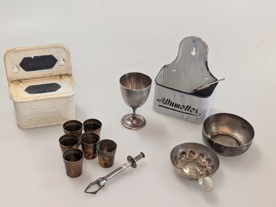 a lot of silver items that are on the table