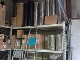 many boxes and boxes on the shelves in the garage