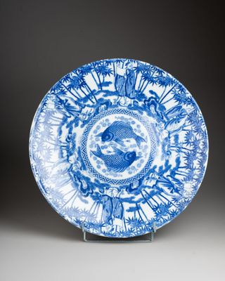 a blue and white plate with a circular design on it