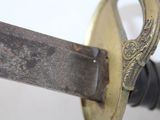 a close up of a sword with a metal handle