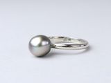 sterling silver ring with a black pearl on a white background