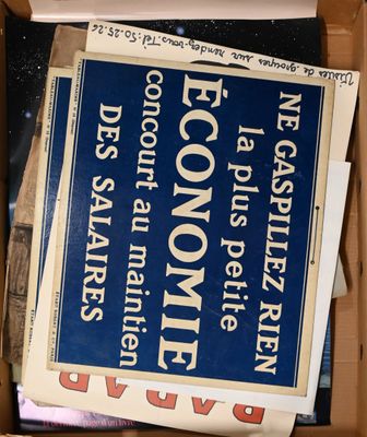 a cardboard box full of newspapers and other papers