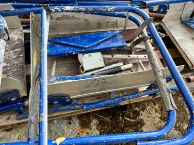 a blue cart that has some tools in it