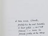 an open book with a handwritten poem on the cover