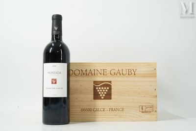 a bottle of wine and a wooden box on a table