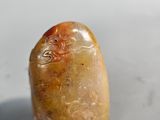 an image of a stone object on a white surface