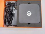 a box with a charger and cables inside of it