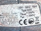 a close up of a parking meter on a sidewalk