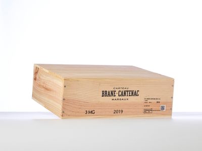 a wooden box with a label on it sitting on a table