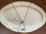 a white plate with a blue butterfly on it