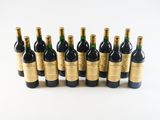 a group of bottles of wine sitting on top of a white surface