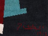 a close up of a rug with a picture of a lighthouse on it