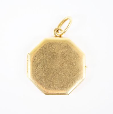 a close up of a gold locke with a chain on a white background