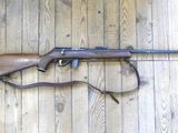 a rifle that is laying on the floor on the floor