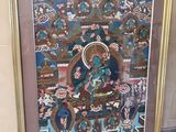 tableau représentant un Bouddha, dans un cadre doré