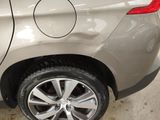 a close up of a car ' s tire with a sticker on it