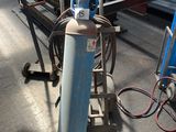 a machine that is sitting on the floor in a warehouse