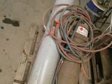 a white tank sitting on top of a pallet in a warehouse