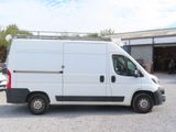 a white van that is parked in a parking lot