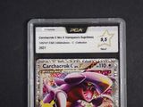 a close up of a pokemon trading card on a black surface