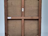 an old wooden easel with a piece of canvas on top of it
